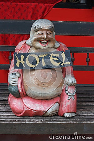 Laughing Buddha hotel sign Stock Photo