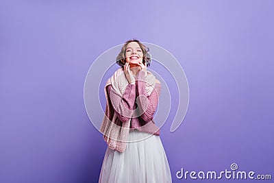 Laughing caucasian lady in winter accessories enjoying photoshoot. Magnificent white girl in lush vintage skirt posing Stock Photo
