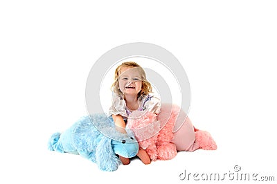 Laughing child holding toy poodles Stock Photo