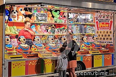A `Laughing Clowns` carnival sideshow game Editorial Stock Photo
