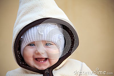 Laughing cute baby girl outside Stock Photo