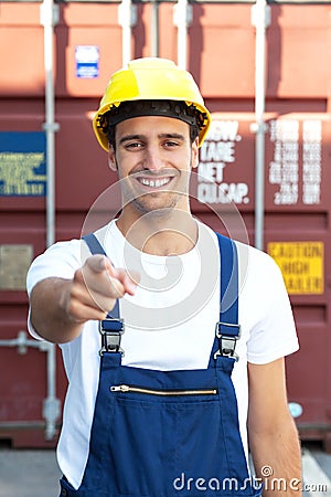 Laughing Docker points to the camera Stock Photo