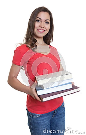 Laughing female student with long dark hair looking and books Stock Photo