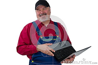 Laughing genial worker or farmer with laptop Stock Photo