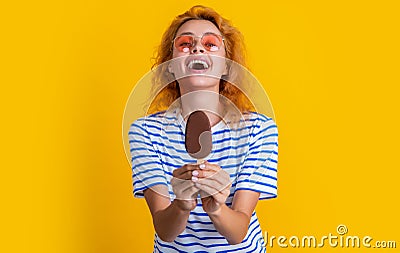 laughing girl with icelolly ice cream in studio. girl with icelolly ice cream on background. Stock Photo