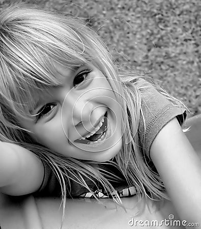 Laughing girl on slide Stock Photo