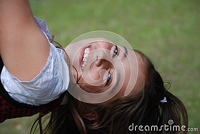 Laughing Girl in a Swing Stock Photo