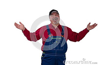 Laughing happy man in dungarees raising his arms Stock Photo