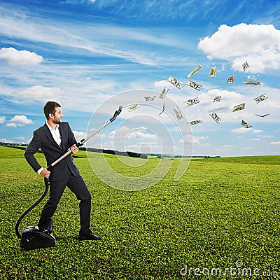 Laughing man catching paper money Stock Photo