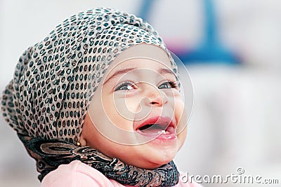 Laughing arab muslim baby girl Stock Photo