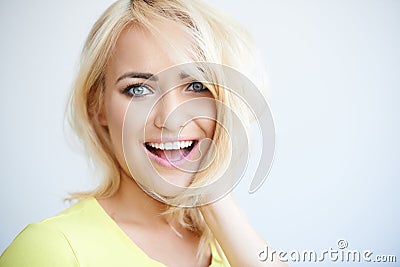 Laughing pretty young blond woman Stock Photo