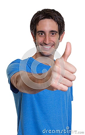 Laughing spanish guy in a blue shirt showing thumb Stock Photo