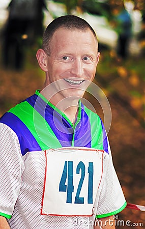 The laughing sportsman before running start Stock Photo