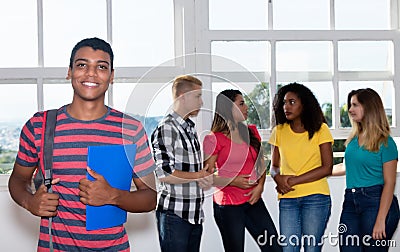 Laughing student from India with international students Stock Photo