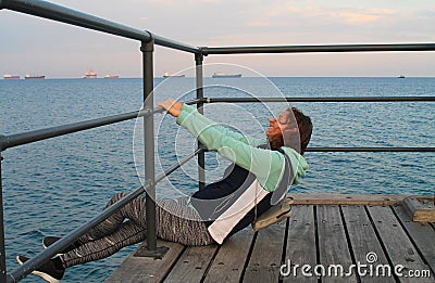 Laughing girl on a sea pier Stock Photo