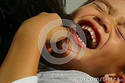 Laughing tickled boy Stock Photo