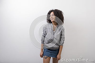 Laughing trendy brunette wearing bomber jacket Stock Photo