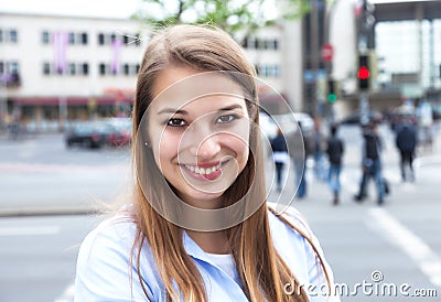 Laughing woman with blond hair in the city Stock Photo