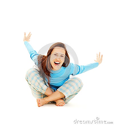 Laughing woman in blue pyjamas Stock Photo