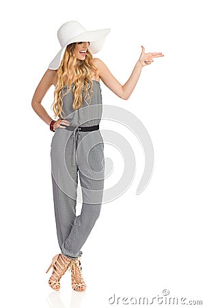 Laughing Woman Is Pointing With Two Fingers Stock Photo
