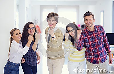 Laughing young business entrepreneurs in trendy clothing celebrating a success Stock Photo