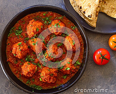 Vegan meatballs curry served with flatbread Stock Photo