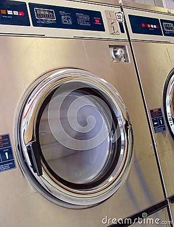 Laundromat washer running Stock Photo