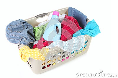 Laundry Basket Full of Dirty Clothes and Softener Stock Photo