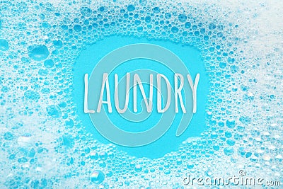 Laundry concept. Soap suds foam and bubbles from detergent Stock Photo