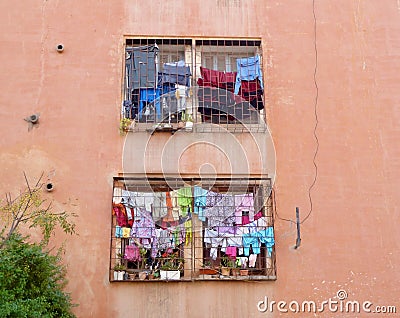 Laundry day in Marrakech, colorful clothes hanging outside the window. Morocco. Stock Photo