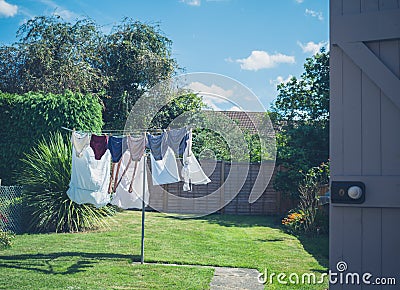 Laundry drying in garden Stock Photo