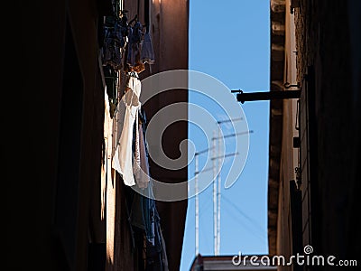 Laundry hanging in a street in Venice on a sunny day in winter Stock Photo