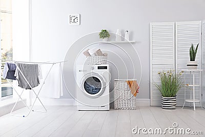 Laundry room interior with washing machine Stock Photo