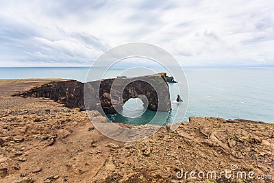 lava arch on Dyrholaey promontory in Iceland Stock Photo