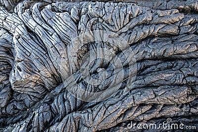 The smooth, undulating surface of frozen pahoehoe lava Stock Photo