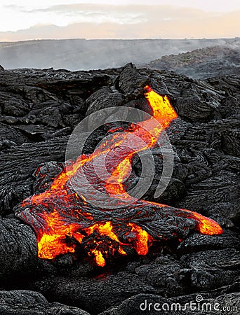 Hawaii Kilauea flowing lava in morning light Stock Photo