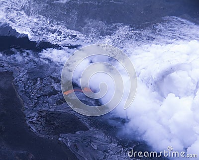 Lava flow into sea Stock Photo