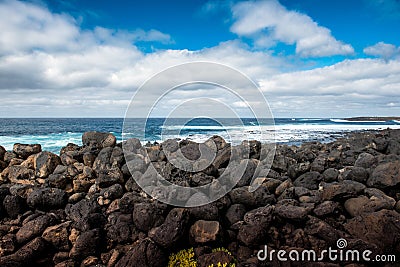 Lava rocks breakwater Stock Photo