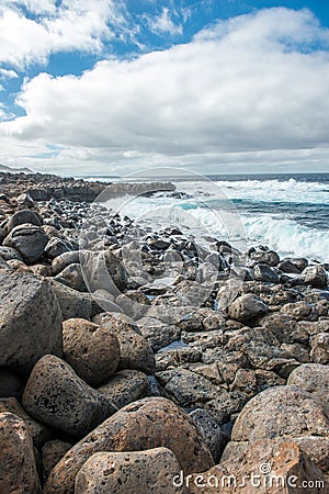 Lava rocks breakwater Stock Photo