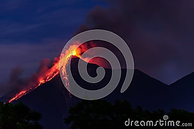 Lava spurts from erupting Fuego volcano in Guatemala Stock Photo