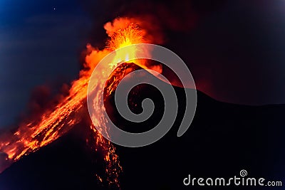 Lava spurts from erupting Fuego volcano in Guatemala Stock Photo