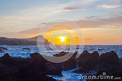 Lava stones on the beach of Piscinas Naturais Biscoitos. Atlantic Ocean. Terceira Azores, Portugal. Stock Photo