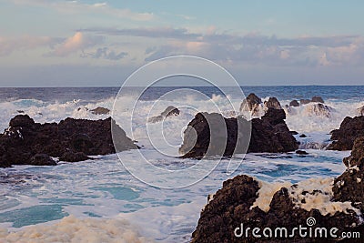 Lava stones on the beach of Piscinas Naturais Biscoitos. Atlantic Ocean. Terceira Azores, Portugal. Stock Photo