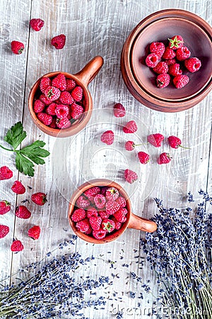 Laveder composition with raspberry in pottery cup rustic background top view Stock Photo