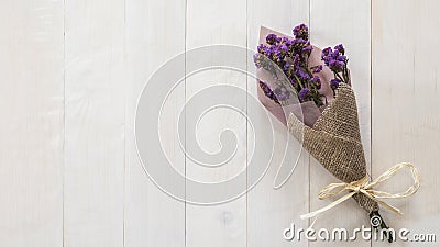 Lavender flower branch bundle dried white wood texture backdrop Stock Photo