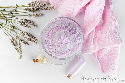 Lavender spa setting: salt, essential oil and dried flowers natural spa products and decor for bath on light background Stock Photo