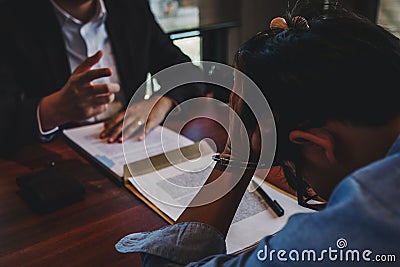 Law enforcement officer interrogating Criminals male with handcuffs in the investigation room Police officer interviewing after Stock Photo