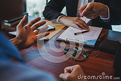 Law enforcement officer interrogating Criminals male with handcuffs in the investigation room Police officer interviewing after Stock Photo