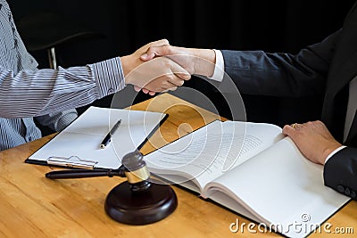 Law and Legal concept, Consultation between attorneys and clients customer shaking hands discussing contract agreement In Stock Photo