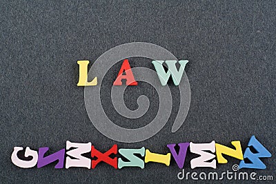LAW word on black board background composed from colorful abc alphabet block wooden letters, copy space for ad text Stock Photo